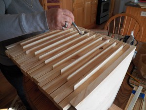 Connie paints on the beeswax